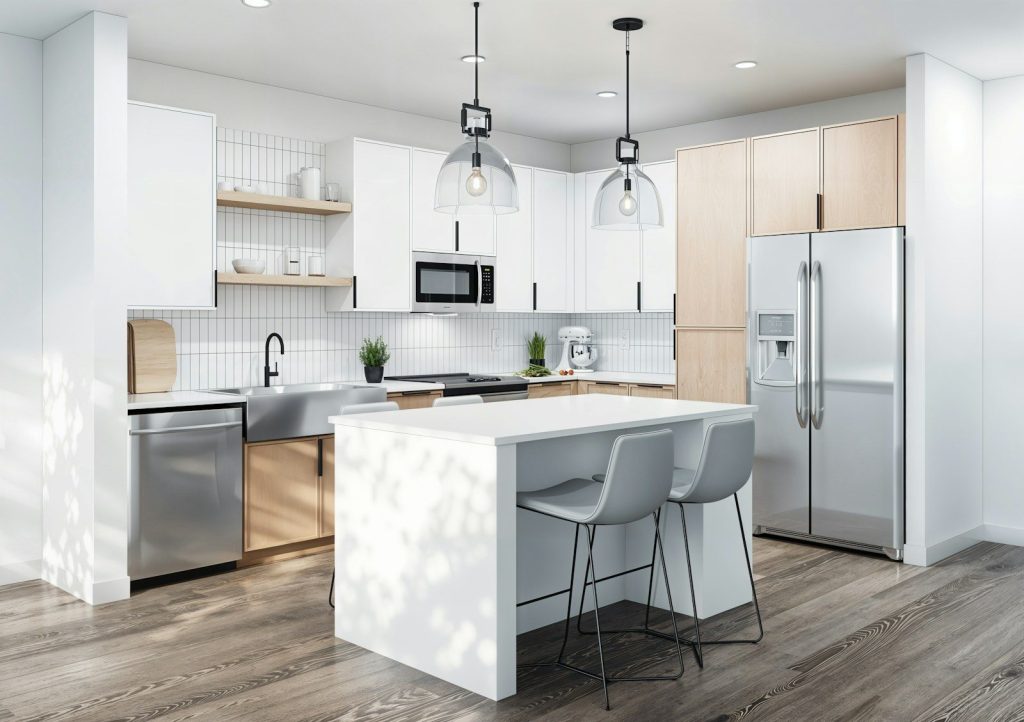 A kitchen with a center island and a refrigerator